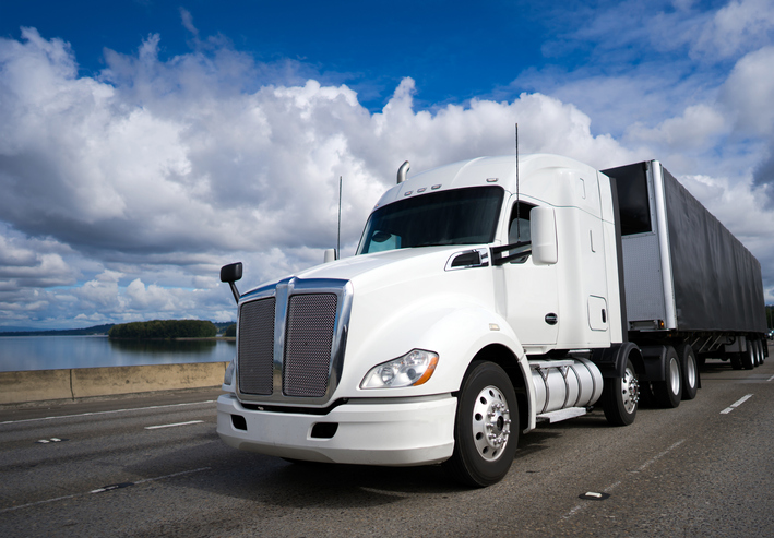 truck driving down coastal highway