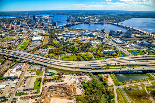 Aerial view of Interstate 95 adjacent to the beautiful downtown district of Jacksonville Florida along the St. Johns River from an altitude of about 1000 feet.